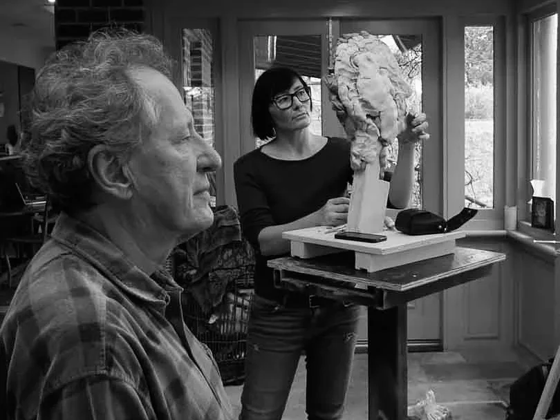 Maudie Brady sculpting the portrait of actor Geoffrey Rush in his home.